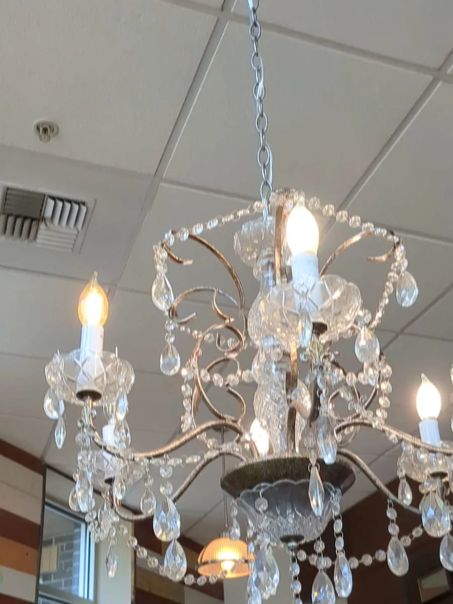 A crystal chandelier hanging above the tables at Cafe Argento.